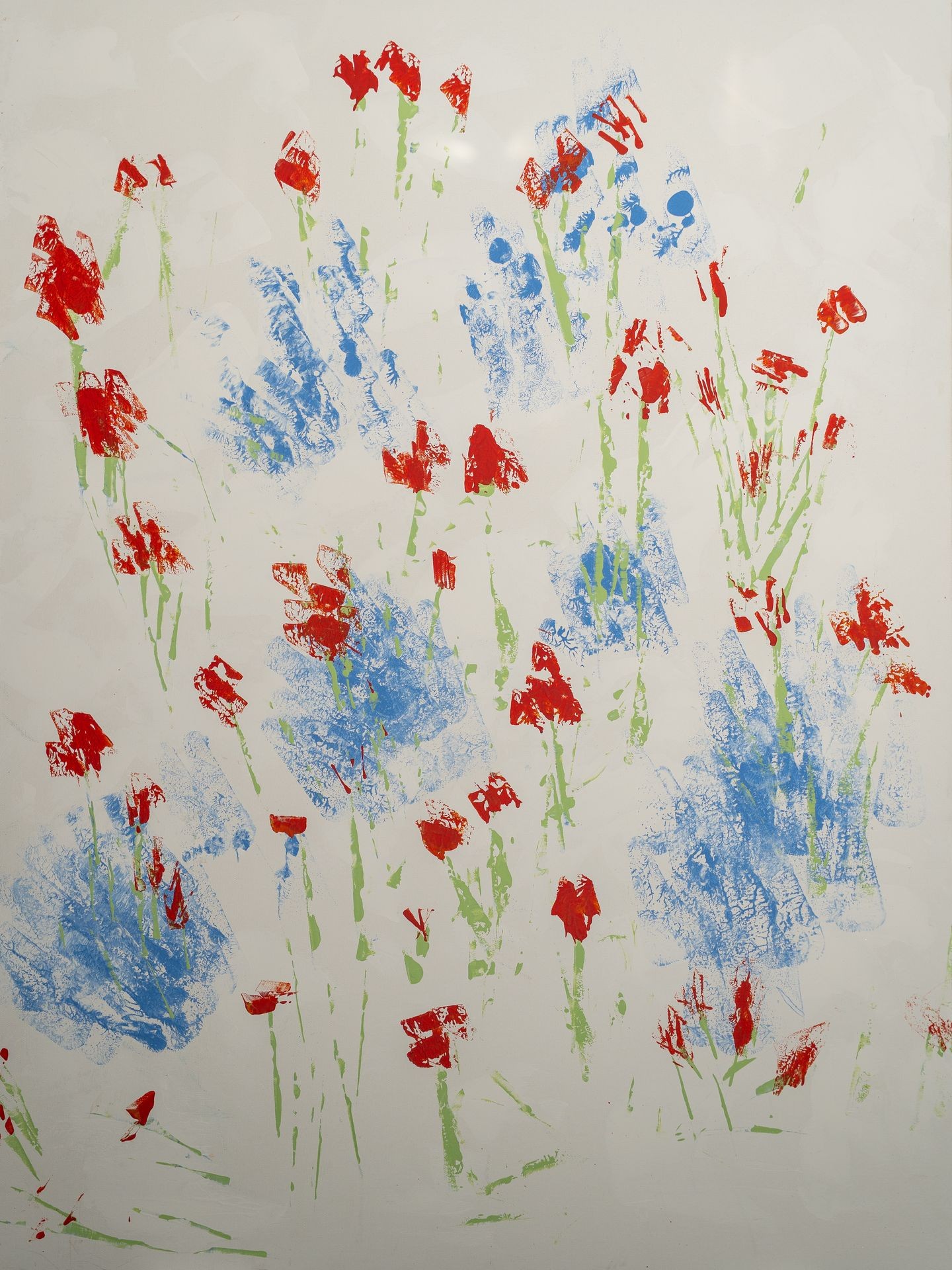 Abstract painting of red and blue flowers with green stems on a white background.